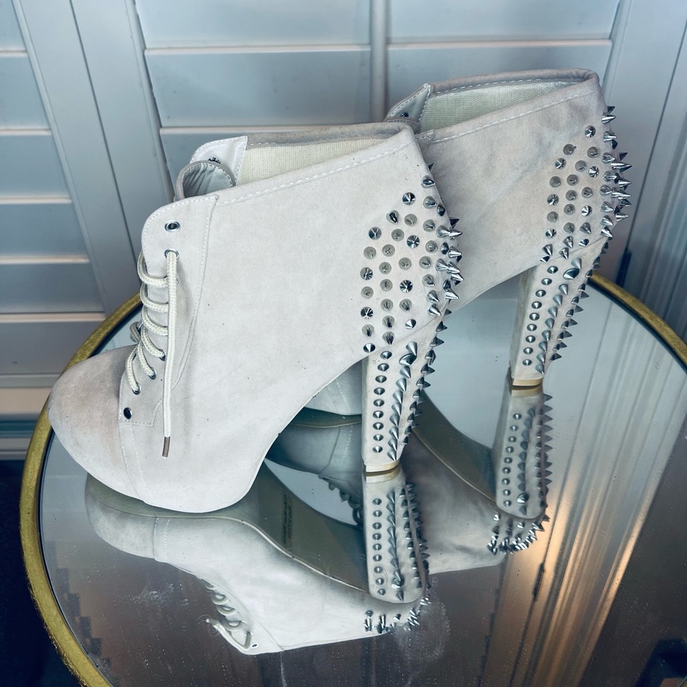 Brand New Suede shoes with spikes. They have never been worn.